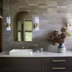 idology-–-casa-bonita-–-sprout-–-hendersonville-nc-–-custom-home-–-bathroom-vanity-arched-mirror-brass-sconces-–-02