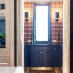 idology-–-casa-bonita-–-sprout-–-hendersonville-nc-–-custom-home-–-butlers-pantry-navy-cabinets-plaid-wallpaper-–-10