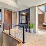 idology-–-casa-bonita-–-sprout-–-hendersonville-nc-–-custom-home-–-entry-foyer-wood-door-cable-railing-dining-beyond-–-15