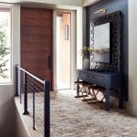 idology-–-casa-bonita-–-sprout-–-hendersonville-nc-–-custom-home-–-entry-foyer-wood-pivot-door-brick-floor-–-04