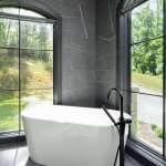 id-ology-european-modern-interior-design-primary-bath-freestanding-tub-arched-windows-02