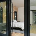 id-ology-european-modern-interior-design-primary-bedroom-steel-door-view-02