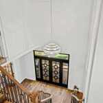 id-ology-fair-oaks-estate-renovation-foyer-chandelier-staircase-after-08