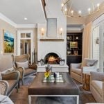 id-ology-fair-oaks-estate-renovation-living-room-fireplace-gold-chandelier-after-13