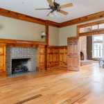 id-ology-fair-oaks-estate-renovation-living-room-knotty-pine-fireplace-before-02