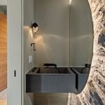 idology-–-hidden-falls-–-kenmure-country-club-–-flat-rock-nc-–-custom-home-–-powder-bath-concrete-sink-oval-mirror-stone-wall-–-15