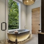 idology-–-hidden-falls-–-kenmure-country-club-–-flat-rock-nc-–-custom-home-–-primary-bath-gold-tub-chandelier-garden-view-–-17