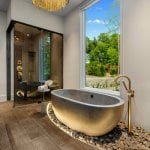 idology-–-hidden-falls-–-kenmure-country-club-–-flat-rock-nc-–-custom-home-–-primary-bath-gold-tub-river-rocks-wide-angle-–-07