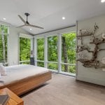 idology-–-hidden-falls-–-kenmure-country-club-–-flat-rock-nc-–-custom-home-–-primary-bedroom-wood-platform-bed-driftwood-wall-art-–-06