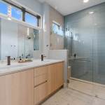 idology-–-overlook-escape-–-couch-mountain-–-fletcher-nc-–-custom-home-–-primary-bath-dual-vanity-glass-shower-–-04