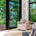 idology-–-southcliff-horizon-–-southcliff-–-fairview-nc-–-custom-home-–-sitting-room-armchair-floor-to-ceiling-windows-–-07
