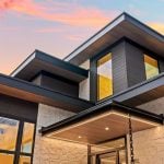 idology-–-stoneridge-haven-–-laurel-ridge-farms-–-waynesville-nc-–-custom-home-–-exterior-entry-roofline-detail-dusk-–-06