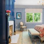 id-ology-–-the-arboretum-garden-house-–-biltmore-forest-–-asheville-nc-–-renovation-–-bedroom-navy-fireplace-floral-bedding-blue-wallpaper-–-18