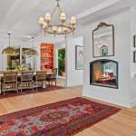 id-ology-–-the-arboretum-garden-house-–-biltmore-forest-–-asheville-nc-–-renovation-–-dining-living-double-sided-fireplace-pink-sofa-orange-bar-–-09