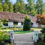 id-ology-–-the-arboretum-garden-house-–-biltmore-forest-–-asheville-nc-–-renovation-–-exterior-front-shingled-roof-driveway-gated-entrance-–-17