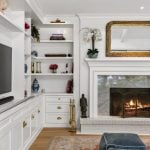 id-ology-–-the-arboretum-garden-house-–-biltmore-forest-–-asheville-nc-–-renovation-–-family-room-built-in-tv-white-fireplace-gold-mirror-–-13