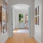 id-ology-–-the-arboretum-garden-house-–-biltmore-forest-–-asheville-nc-–-renovation-–-hallway-gallery-wall-archway-canopy-bed-–-01