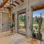 id-ology-–-waterfall-overlook-–-hendersonville-nc-–-custom-home-–-foyer-stone-column-potted-palms-–-28
