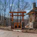 idology-zen-mountain-haven-high-hickory-mountain-swannanoa-nc-custom-home-exterior-torii-gate-stone-columns-02