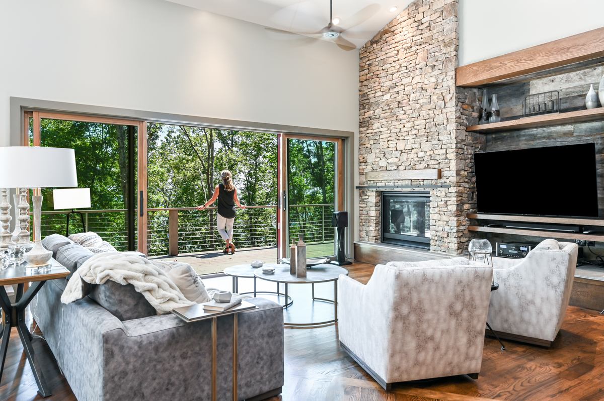 id-ology-budin-residence-whole-home-build-living-room-stone-fireplace-sliding-doors-01